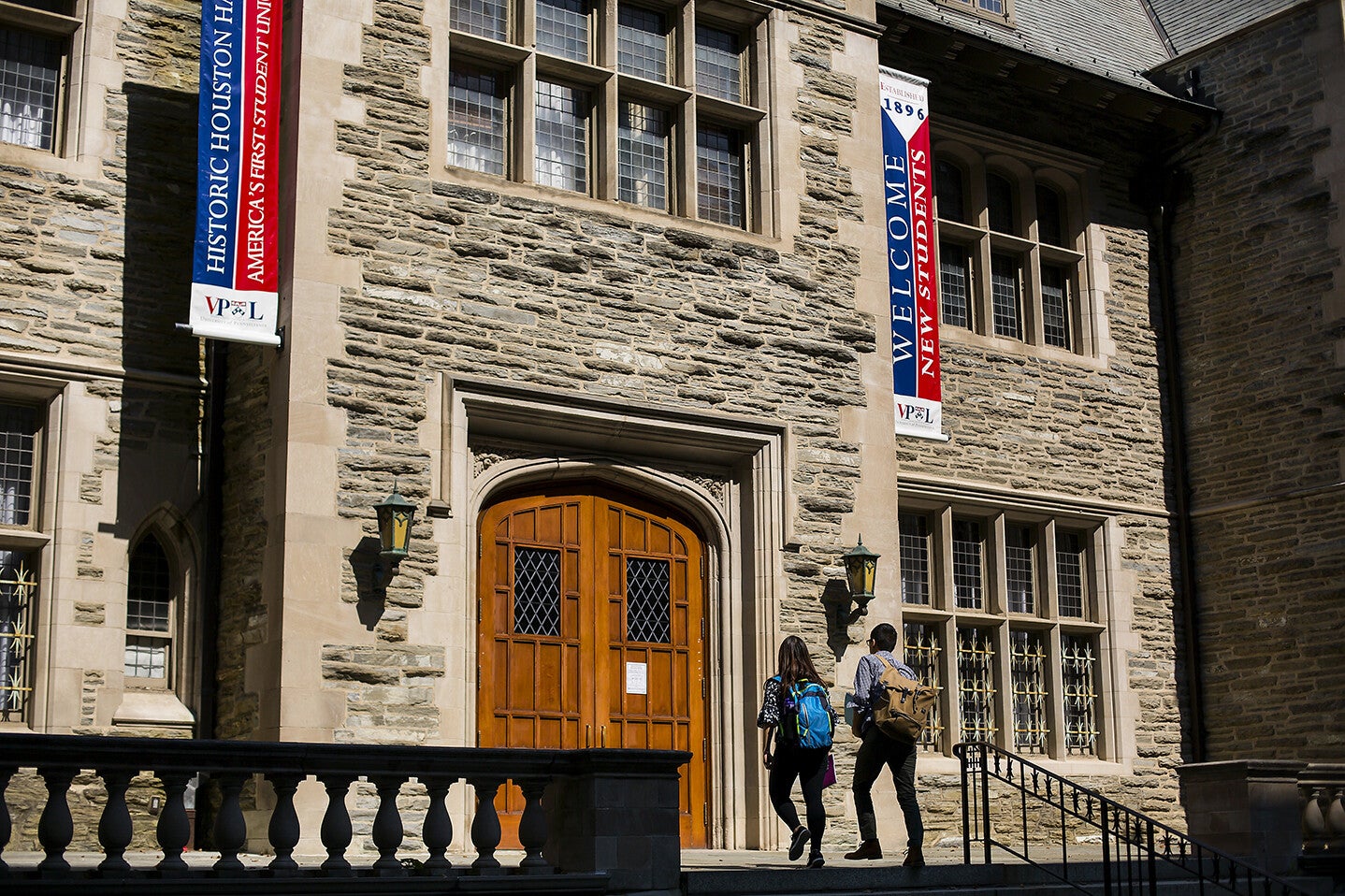 Students walking into Houston Hall
