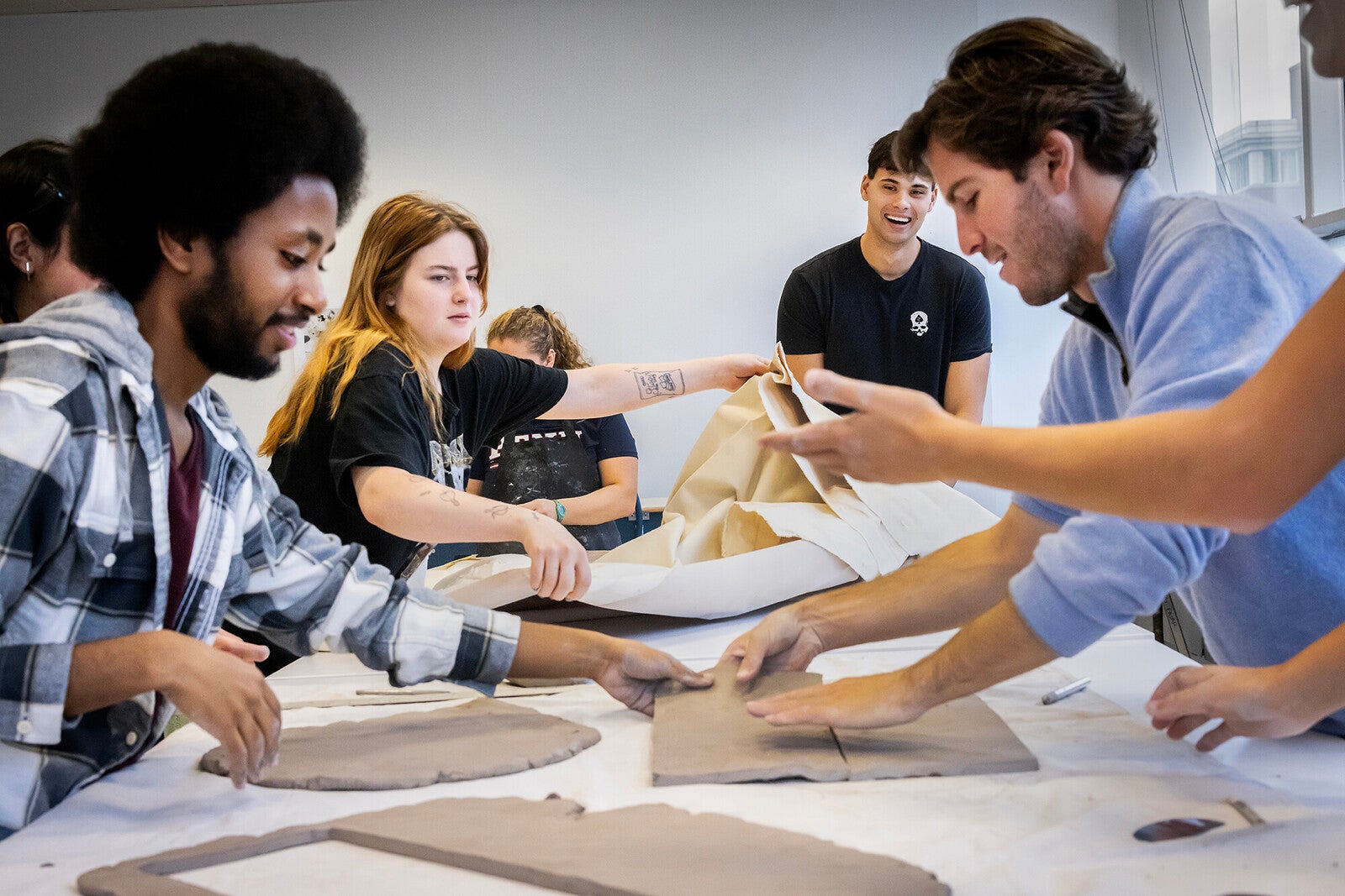 students working with ceramics