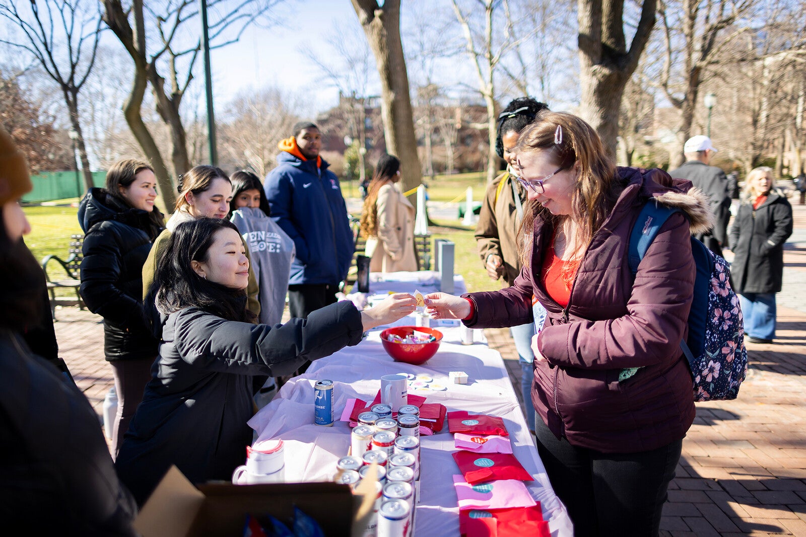 volunteers on college green promoting election day