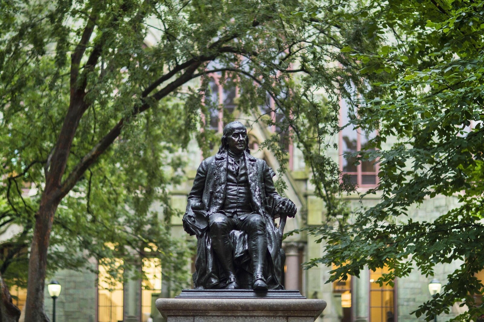 ben franklin statue in front of college hall