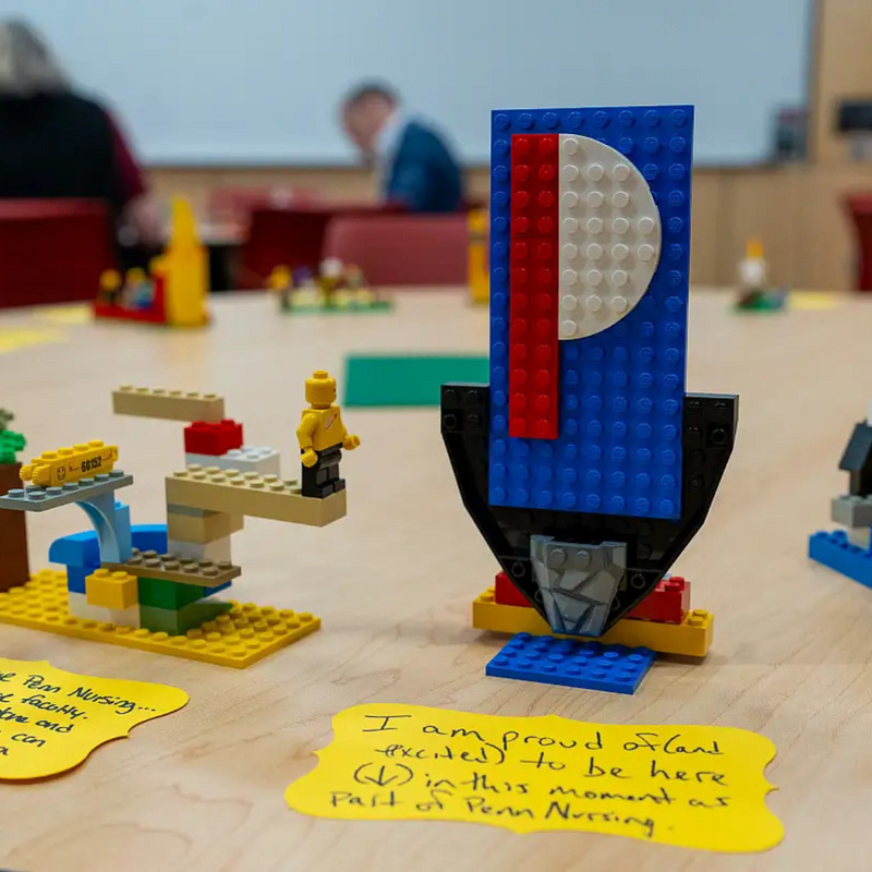 Legos in the shape of a "P" on a table during a Penn Nursing Event